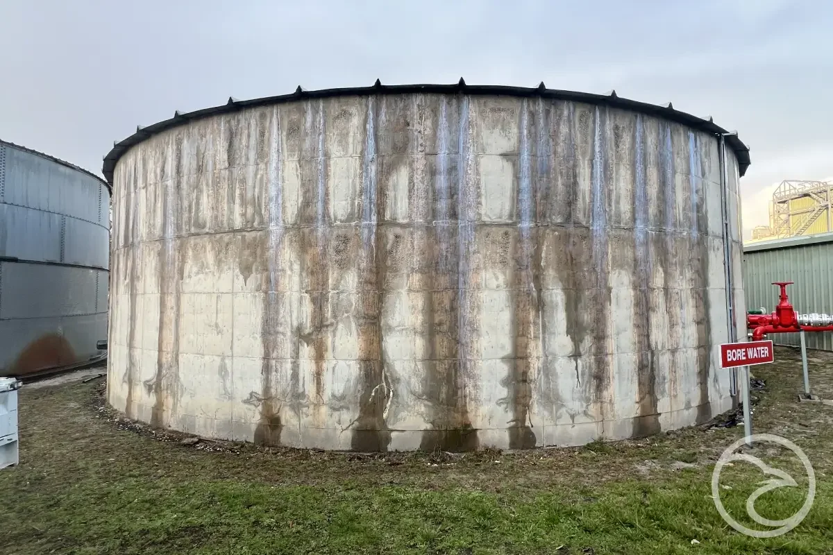 Water tank showing deformation from structural stress